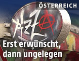 Schild mit der Aufschrift Pizza mit Anarchie-Zeichen