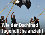 Jungendliche mit islamistischen Fahnen