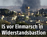 Blick von der t&uuml;rkischen Grenze aus auf die umk&auml;mpfte syrische Stadt Ain al-Arab