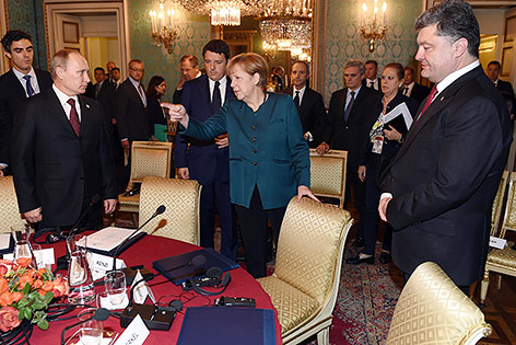 © APA/AP/Daniel Dal Zennaro Russischer Präsident Wladimir Putin und die deutsche Kanzlerin Angela Merkel