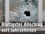 Zerschossene Glasscheibe
