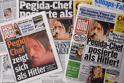 © APA/EPA/Marcus Brandt PEGIDA-Chef Lutz Bachmann auf Zeitungscovern mit Hitler-Bart