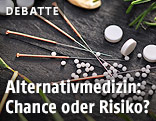 Akupunkturnadeln und Globuli