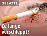 Zigarette in Aschenbecher