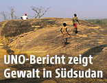 Menschen auf einem Hügel