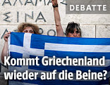 Frauen halten griechische Flagge