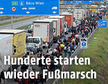 Flüchtlinge zu Fuß auf der Autobahn