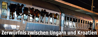 Fl&uuml;chtlinge in einem Zug