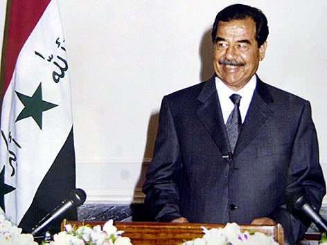 © AP/INA/Pool Saddam Hussein