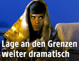 Flüchtling an deutsch-österreichischer Grenze
