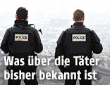 Polizisten blicken auf Paris