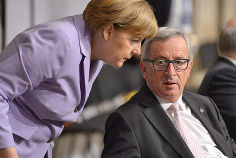 Die deutsche Kanzlerin Angela Merkel und EU-Kommissionspräsident Jean-Claude Juncker