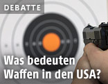 Handfeuerwaffe vor einer Zielscheibe