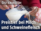 Milchkanne und Glas mit Milch
