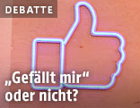 Leuchtschild mit Facebook-Daumen