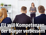 Menschen bei einem Vortrag