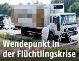 Ermittler vor dem betroffenen Lastwagen auf der A4 bei Parndorf