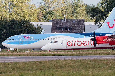 © APA/AFP/dpa/Julian Stratenschulte Flugzeuge der Linien Air Berlin und TUIfly