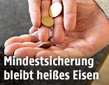 H&auml;nde mit M&uuml;nzen