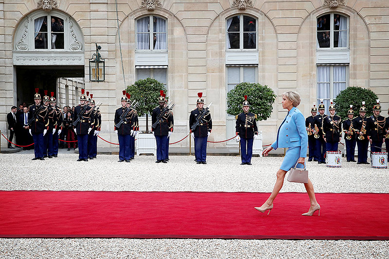 © Reuters/Christian Hartmann Brigitte Macron