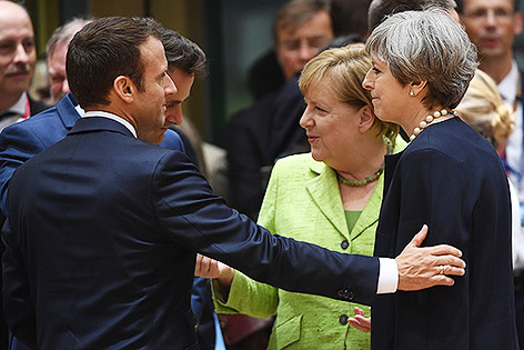 Emmanuel Macron, Angela Merkel, Theresa May