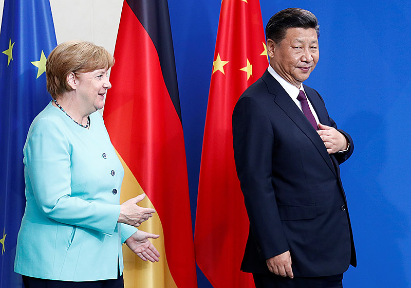 © Reuters/Fabrizio Bensch Deutschlands Kanzlerin Angela Merkel und Chinas Staatschef Xi Jinping