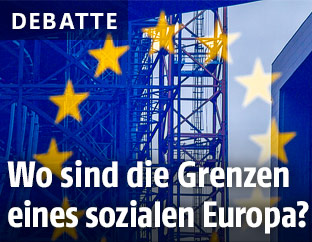 Kran hinter einer EU-Flagge