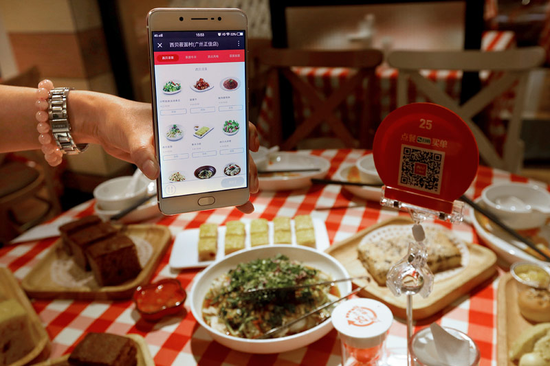 © Reuters/Bobby Yip WeChat zur Bezahlung in Restaurant