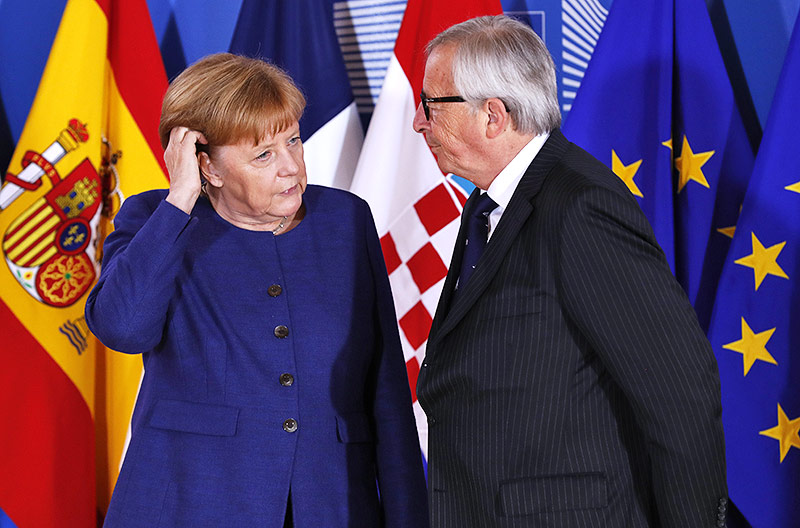© APA/AFP/Yves Herman Bundeskanzlerin Angela Merkel und Jean Claude Juncker